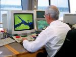ID 8495 VESSEL TRAFFIC SERVICES (VTS) monitor all vessel movements at the Port of Southampton and in the waters of the Solent from their operations room looking south down Southampton Water.