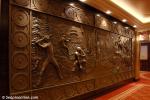 ID 5216 QUEEN MARY 2 (2003/148528grt/IMO 9241061) - One of the four bronze murals depicting significant destinations visited by Queen Mary 2 near the Pursers Office on Deck 2/3L.
This one depicts the USA and...