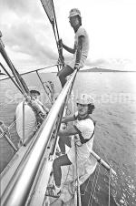 ID 5902 SPIRIT OF ADVENTURE (1973) a former Auckland, NZ-based sail-training topsail-schooner operates today as SPIRIT OF THE PACIFIC in Fiji. Crew members are seen here at work on the bowsprit as the ships...