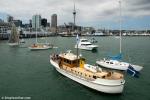ID 7606 AKARANA (1960) a former Auckland Harbour Board pilot launch, now fully restored, waits for passingtraffic to clear before approaching the Voyager New Zealand Maritime Museum berth at Hobson Wharf,...