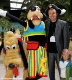 ID 7474 DISNEY WONDER (1999/83308grt/IMO 9126819) - British TV presenter Paul Ross (brother of Jonathon) with Disney characters Goofy and Pluto prior to boarding the ship for a lavish children-friendly (who...