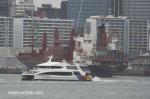 ID 11664 KWANGTUNG (1994/18451grt/IMO 9070709, ex-TASMAN PROVIDER, MERIDIAN CHALLENGER, DELMAS FORBIN) sails for Brisbane as Fullers ferry KORORA heads for Waiheke Island.
