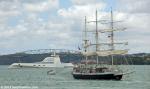 ID 9267 LORD NELSON (UK) outbound from Auckland with the megayacht A anchored mid-harbour astern.