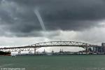 ID 7694 WATERSPOUT - On yet another day typical of the Auckland 2011-12 summer, waterspouts formed over many parts of the harbour. This one touched down on the harbour moments after the bulk carrier CLEANTEC...